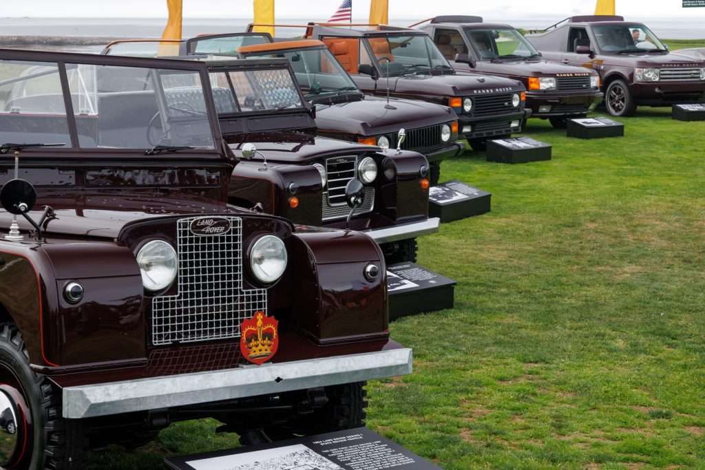 UNIQUE SHOWCASE OF VEHICLES USED BY HM QUEEN ELIZABETH II CROWNS DEFENDER AND RANGE ROVER PARTICIPATION AT MONTEREY CAR WEEK